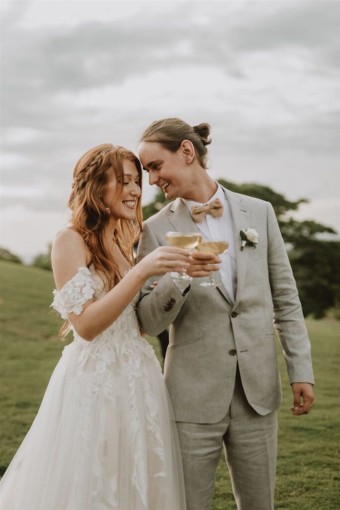 bride and groom toasting their love