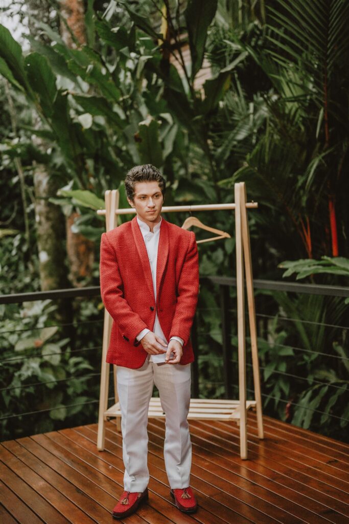 Groom in red jacket