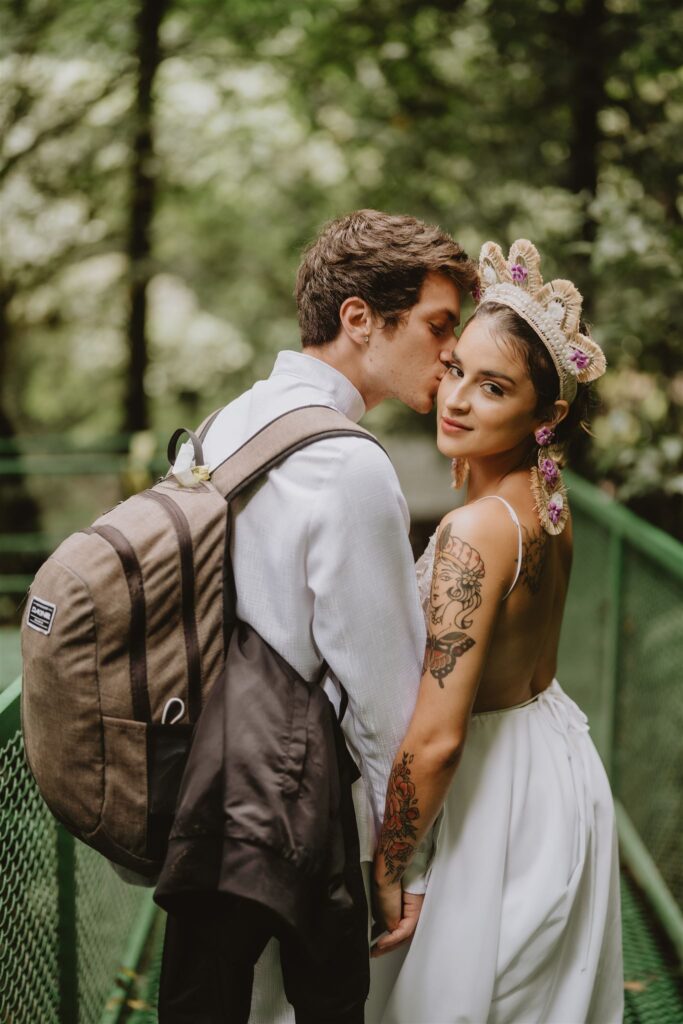 kiss on the bridge on the way to the waterfall costa rica